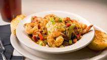 The Real New Orleans Style Restaurant's Shrimp and Grits The Real New Orleans Style Restaurant's Shrimp and Grits