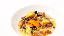 Chicken soup with glazed wild mushrooms and confit egg yolk Chicken soup with glazed wild mushrooms and confit egg yolk
