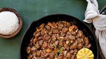 Sizzling Sisig (Filipino Crispy Pork with Eggs) Sizzling Sisig (Filipino Crispy Pork with Eggs)