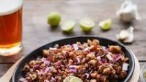 Pork Sisig (Charcoal Grilled, Served on a Sizzling Platter) Pork Sisig (Charcoal Grilled, Served on a Sizzling Platter)