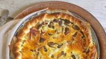 Savory pie with mushrooms, potatoes and speck: the recipe for an easy and delicious course Savory pie with mushrooms, potatoes and speck: the recipe for an easy and delicious course