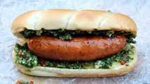 Choripan or chorizo hot dog with chimichurri sauce Choripan or chorizo hot dog with chimichurri sauce