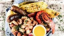 Backyard Seafood Boil with lobster, shrimp, and spicy sausage Backyard Seafood Boil with lobster, shrimp, and spicy sausage